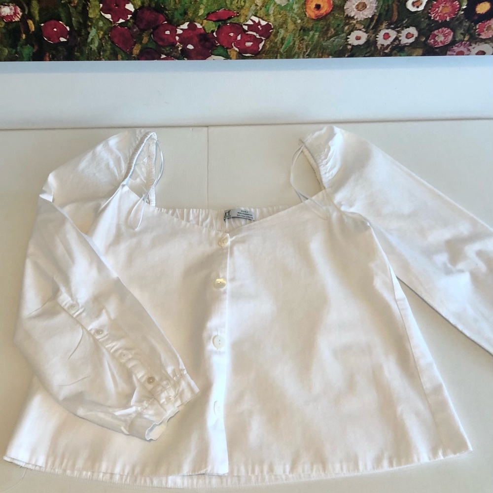 White minimalist very flattering top.